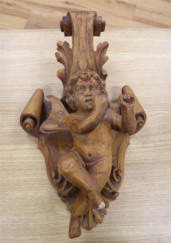 A Florentine style carved boxwood putti wall appliqué, height 53cm